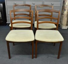 A set of four E-gomme G-Plan dining chairs designed by Victor Wilkins