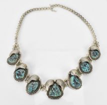 A Native American Navajo white metal and turquoise necklace, with double strand of cushion beads