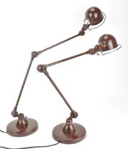 A pair of French Jielde lamps designed by Jean-Louis Dormecq, 1950s, in brown, with articulated arm,