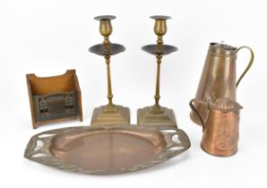 A small collection of Arts and Crafts copper, to include a pair of candlesticks, a tapered