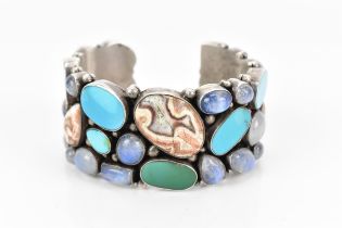 A native American silver, turquoise and rainbow moonstone cuff bracelet, with bezel set cabochon and