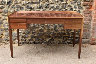 A Norwegian teak desk by Aase Mobler, of rectangular form with frieze drawer flanked by two