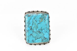 A large Native American Navajo white metal and turquoise cuff bracelet,