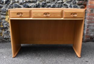 A blonde elm Ercol desk, of rectangular form