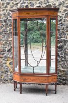 An early 20th century Edwardian string inlaid mahogany vitrine display cabinet, with dentil cornice,