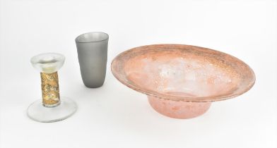 A large post war studio glass UB shaped bowl, in the Monart style in mottled pink with large everted
