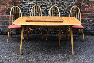 A mid 20th century beech and elm extending Grand Windsor dining table by Ercol,