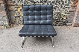 A Barcelona style black leather and chrome lounge chair, 77 cm high x 77 cm wide