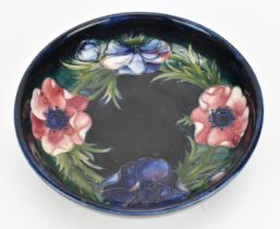 A Walter Moorcroft 'Anemone' pattern bowl, circa 1940-49, designed with tube-lined blooms to the