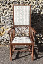 Attributed to J.S Henry, an Arts and Crafts walnut armchair, circa 1910, designed with rectangular