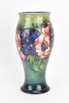 A Walter Moorcroft vase in the 'anemone' pattern, circa 1950, of baluster form with everted rim,