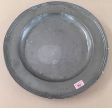 A large 18th century pewter charger, 18" diameter Location: RAM