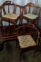 Three Edwardian mahogany corner chairs to include a matching pair, having pierced splat backs