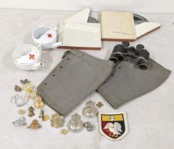 Militaria to include invalid feeders, cap badges, anklets, 8mm films and binoculars Location: