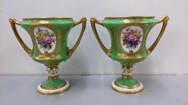 A pair of early 20th century royal Crown Derby twin handled vases by William Mosley having a green