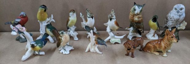 A selection of porcelain animal ornaments to include Karl Ens birds, Bretby style majolica spill