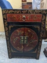 A late 20th century painted Chinese cabinet with a drawer and a pair of doors Location: