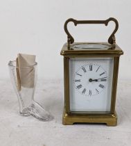 An early 20th century carriage clock A/F, together with an Edwardian glass gin vessel in the form of