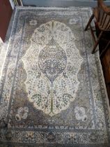 A 20th century Turkish (?) Islamic style hand knotted rug, central floral motifs, multi guard