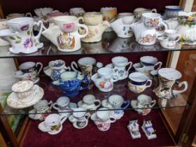 A collection of Victorian and later shaving mugs, along with a moustache cup and saucer, and a