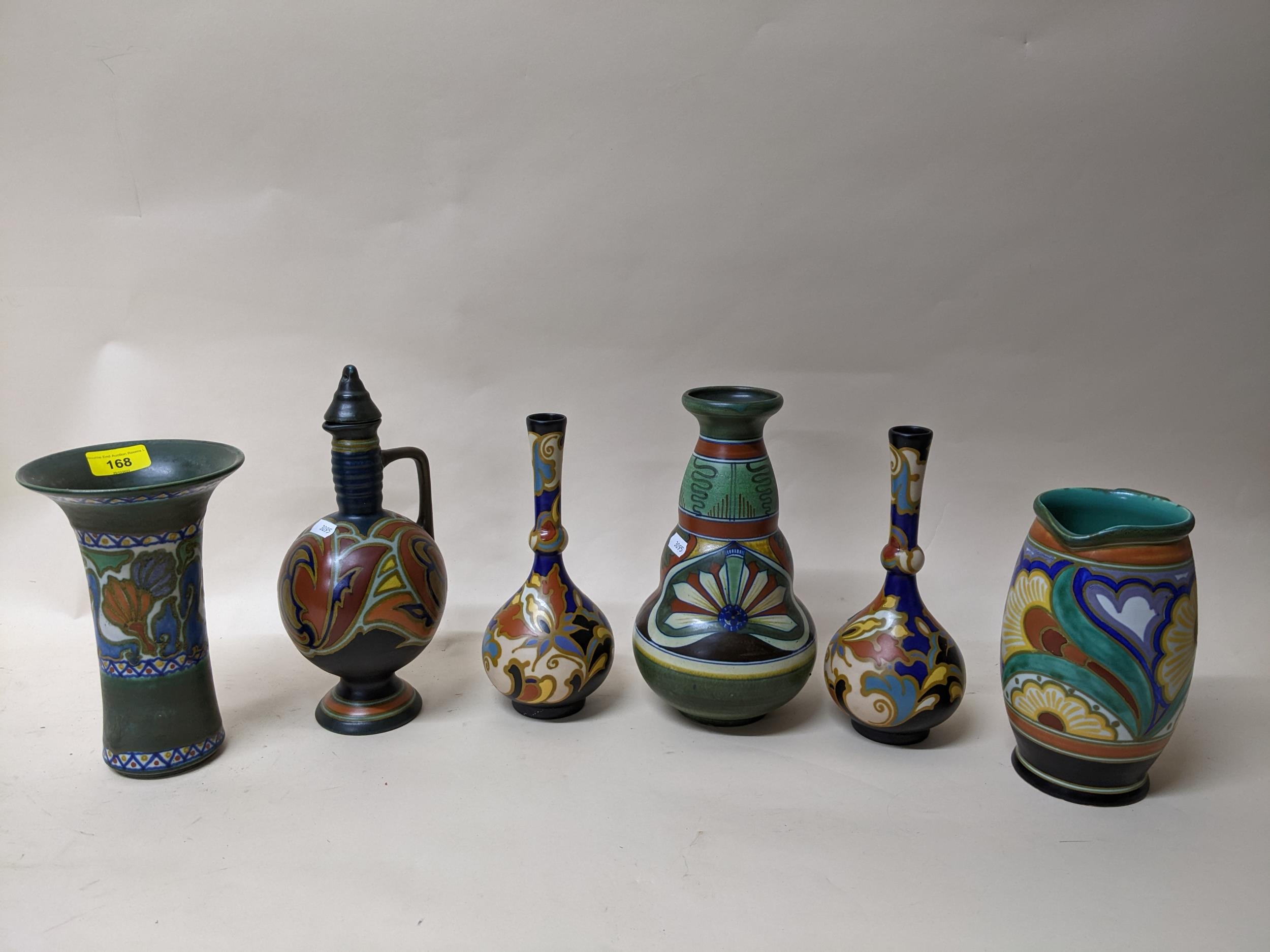 A group of Dutch Gouda pottery items to include a Gouda Voon vase circa 1918 of double gourd