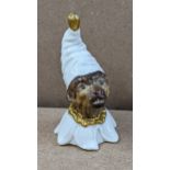 A Royal Worcester novelty candle snuffer modelled as a monkey in a night cap Location