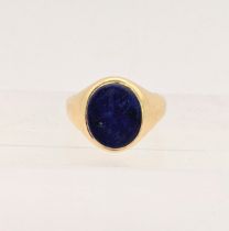 A George V 18ct yellow gold signet ring et with an oval blue stone plaque, Sheffield 1925, numbers