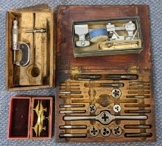 A collection of watchmakers tools to include a Depthing compass, precision lathe and other items