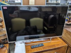 A Sony Bravia 42" flatscreen TV with remote, and Quick Start Guide Location: