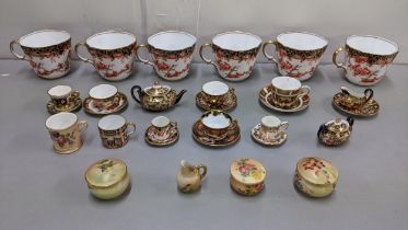A selection of Royal Crown Derby Imari pattern porcelain to include 2649 pattern cups, and miniature