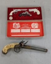 A European Liege XViii S Lock pistol gun replica, together with a The Outlaw presentation case of