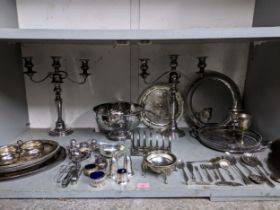 A quantity of silver plate to include a pair of three-branch table candelabras, various cruet