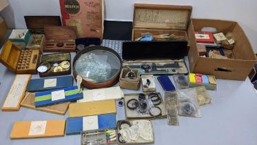 A mixed lot to include clock glasses, boxed set of watch hands, mainsprings and other items