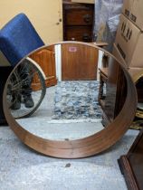 A late 20th century IKEA, teak finished circular mirror Location: