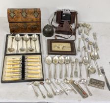 Silver plate flatware to include forks and spoons, a Victorian walnut and brass casket and a print