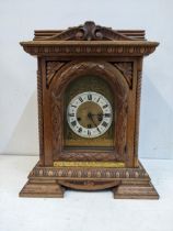 An early 20th century walnut cased mantel clock with a Junghams gong striking movement Location: G