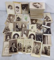 A collection of Victorian cabinet cards housed in a red lacquered box Location: