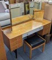 A retro Meredew light oak dressing table having three mirrors above seven drawers, 119cm h x 129.5cm