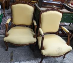 A pair of mid 20th century French style beech carved armchairs Location: