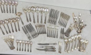 A collection of silver plated cutlery and flatware to include teaspoons, servings spoons, butter and