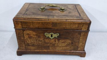 A Victorian mahogany tea caddy having boxwood string inlaid and fitted interior Location: