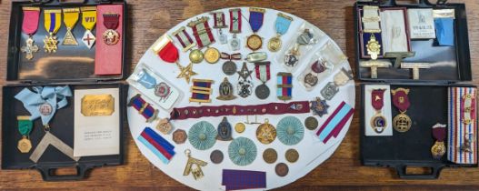 A collection of Masonic related times to include medals, tokens, badges and others along with a name