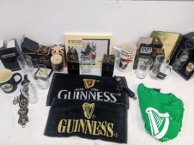 Guinness related collectables to include boxed glasses, mugs, table mats, bar mats, tankards,