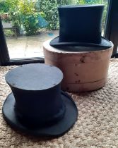 A Lock & Co Hatters of St James Street black brushed silk top hat together with an Alfred Townend