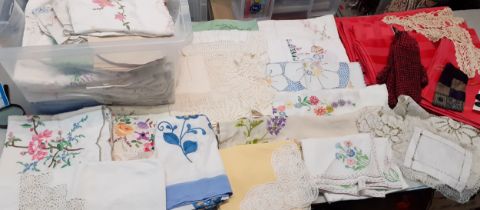 A large quantity of vintage table linen together with a pair of new DKNY woollen gloves and other