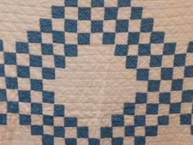 Two 1970's American Mid West blue and white handmade double layer patchwork quilts A/F with machined