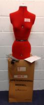 A 1960's Supa-Fit dressmakers mannequin in red together with original box and attachments.
