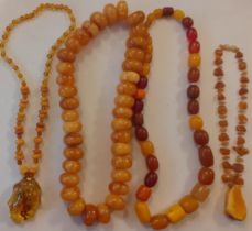 Vintage amber necklaces to include a butterscotch example together with a quantity of amber effect