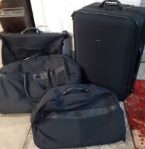 Harrods luggage in black comprising a wheelie bag 28" x 18", a holdall 27" long, another holdall 24"