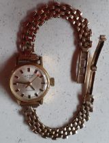 A Rotary ladies cocktail watch having a 9ct gold chain link strap stamped 375 in branded watch box.